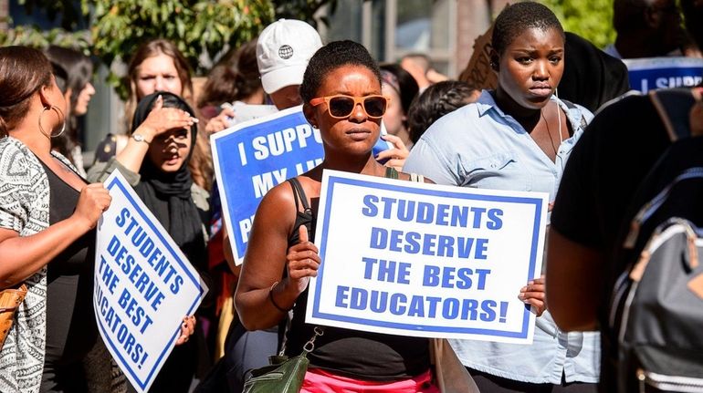 Long Island University students stage a walkout to protest the...