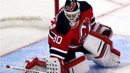 New Jersey Devils goalie Martin Brodeur makes a save on...