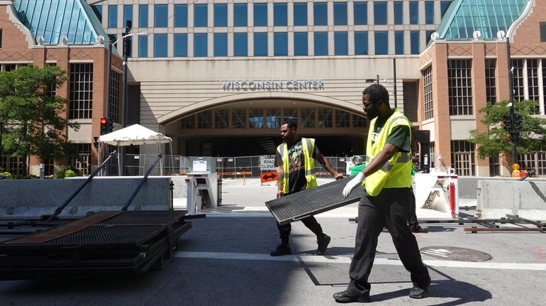 Security fencing is installed outside the Wisconsin Center in Milwaukee...