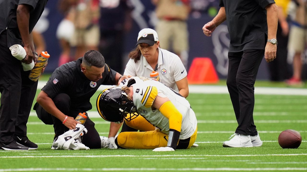 Pittsburgh Steelers quarterback Kenny Pickett rolls out against