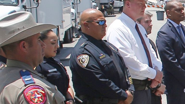 Uvalde School Police Chief Pete Arredondo, center, stands during a...