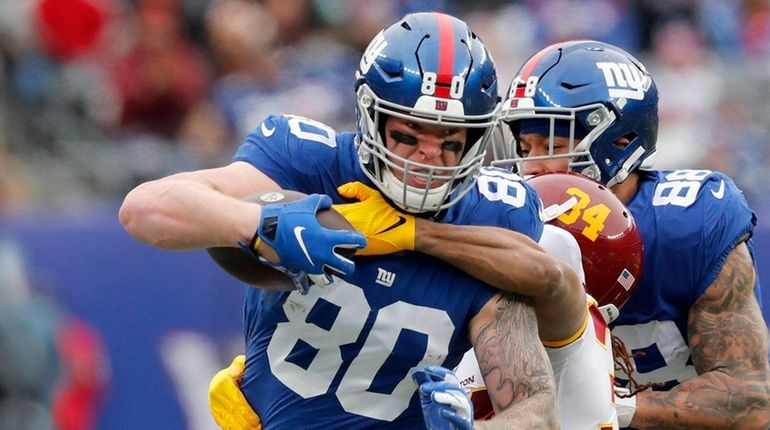 Kyle Rudolph #80 of the Giants runs a reception in...