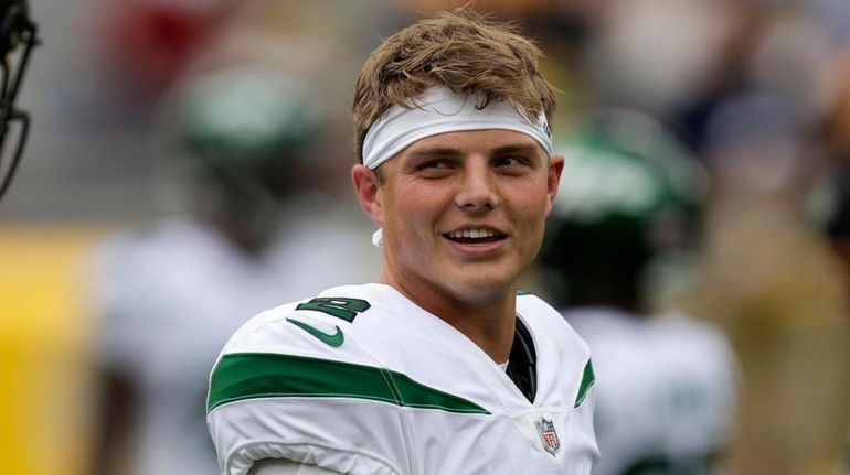 New York Jets' Zach Wilson warms up before a preseason...