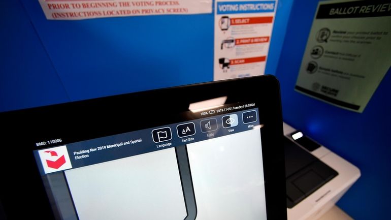 In this Tuesday, Nov. 5, 2019 photo, a touchscreen voting...