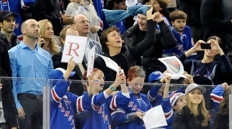 Sir Paul McCartney waves his towel to celebrate J.T. Miller's...