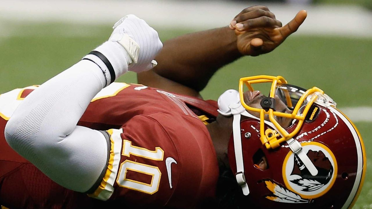 Washington Redskins quarterback Robert Griffin III celebrates a