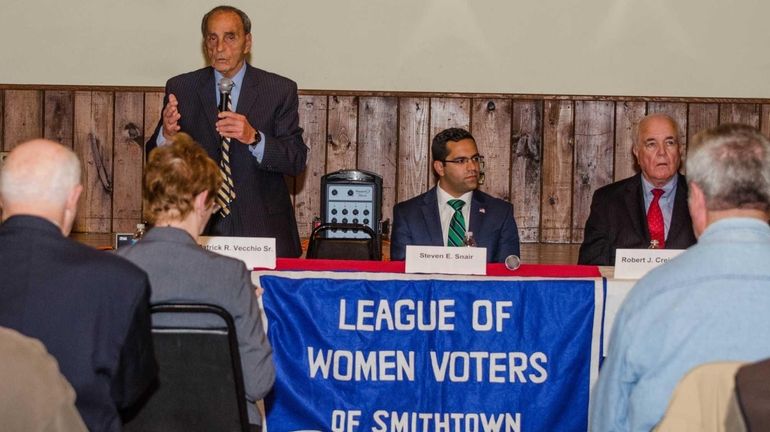 At the debate table are candidates for Town Supervisor of...