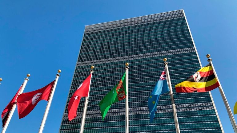 Flags fly outside the United Nations headquarters during the 74th...