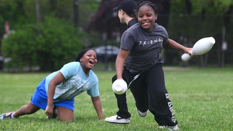 Madeleine Rogers, 10, right, and twin sister Skylar during a...