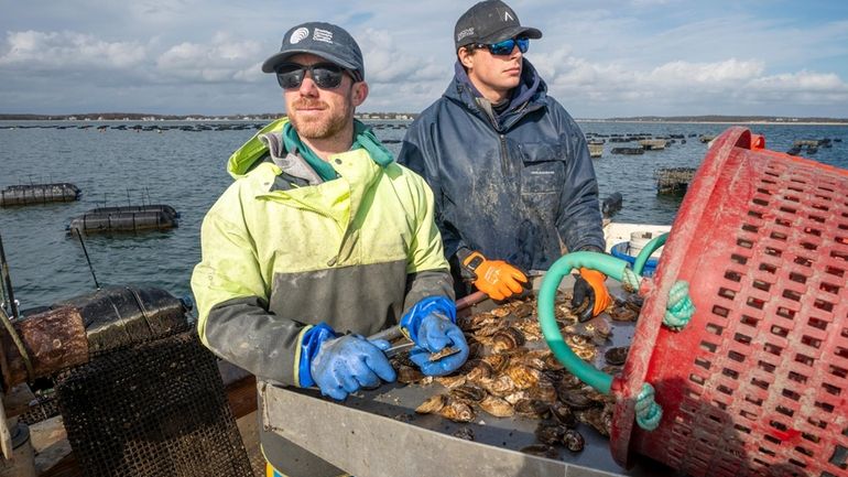 Will Peckham, left, founder of West Robins Oyster Co., and Jack...