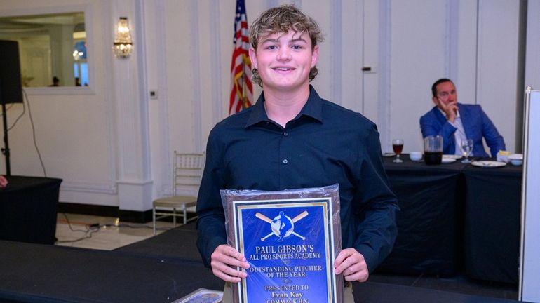 Evan Kay of Commack poses with the Paul Gibson Award during the...