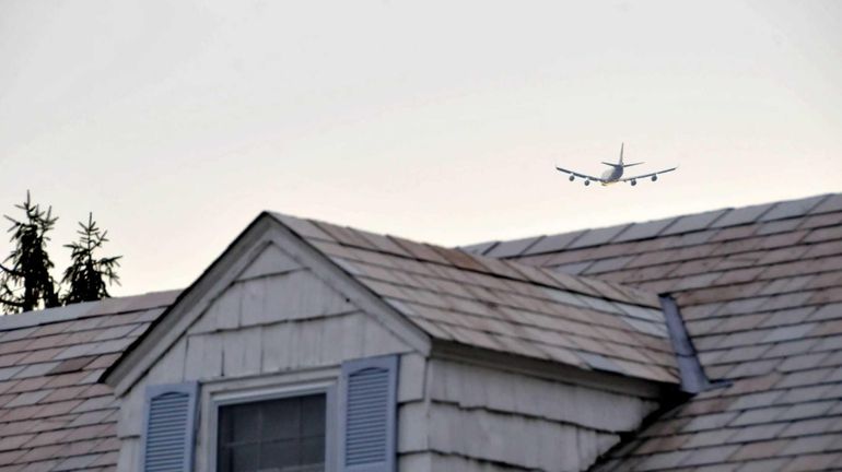 Planes fly over Canterbury Lane in Roslyn on Tuesday, April...