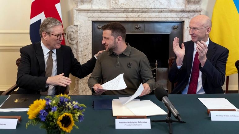 Britain's Prime Minister Sir Keir Starmer, left, and Defence Secretary...