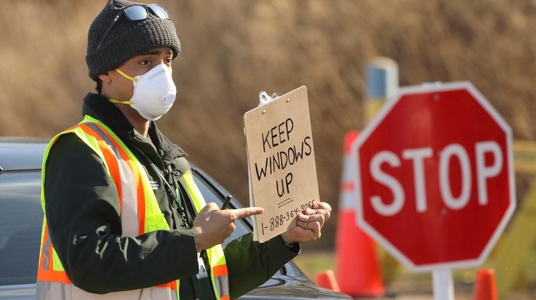 A state worker reminds people to keep their windows up...