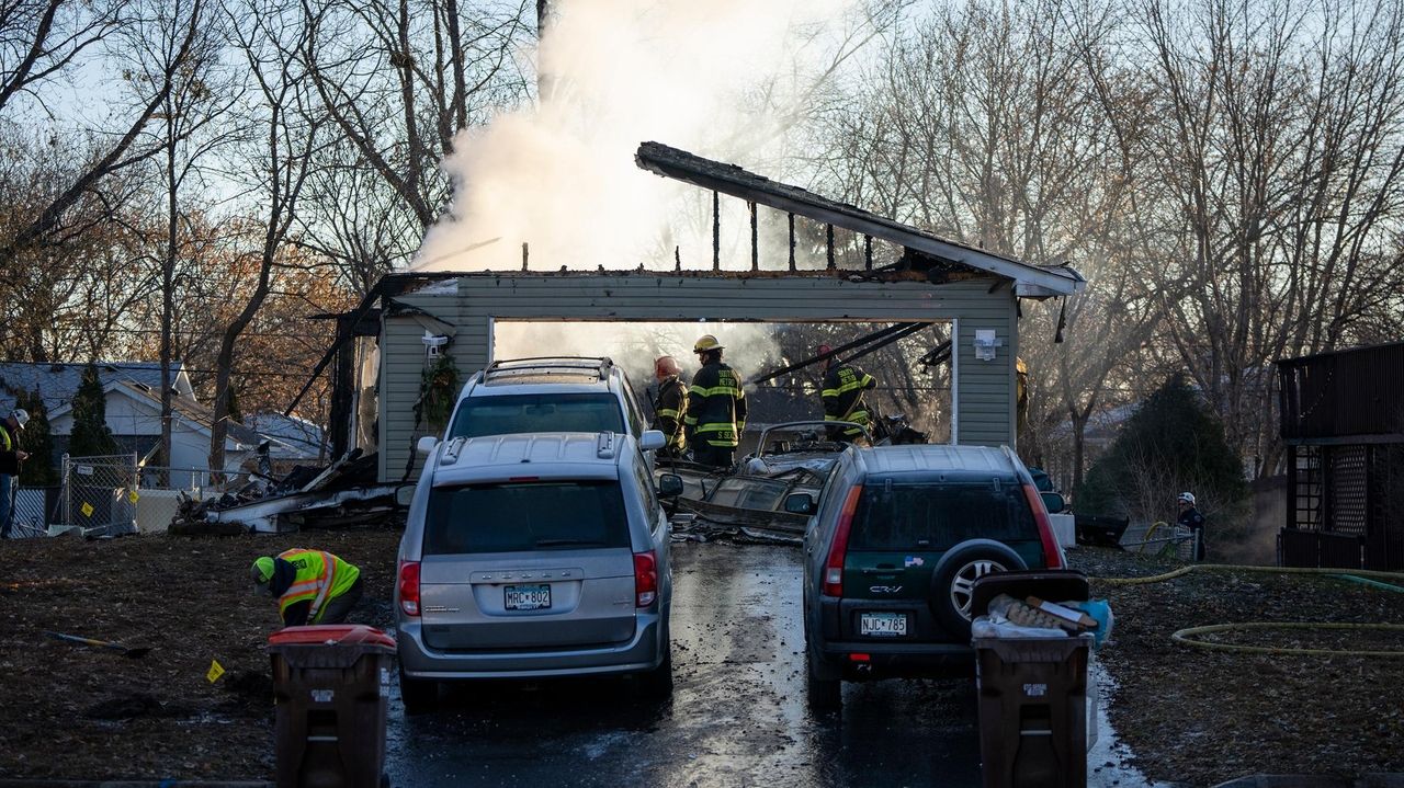 A house explodes and bursts into flames in Minnesota, killing at least
