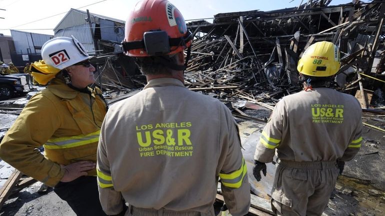 Members of the Los Angeles Fire Department urban search and...