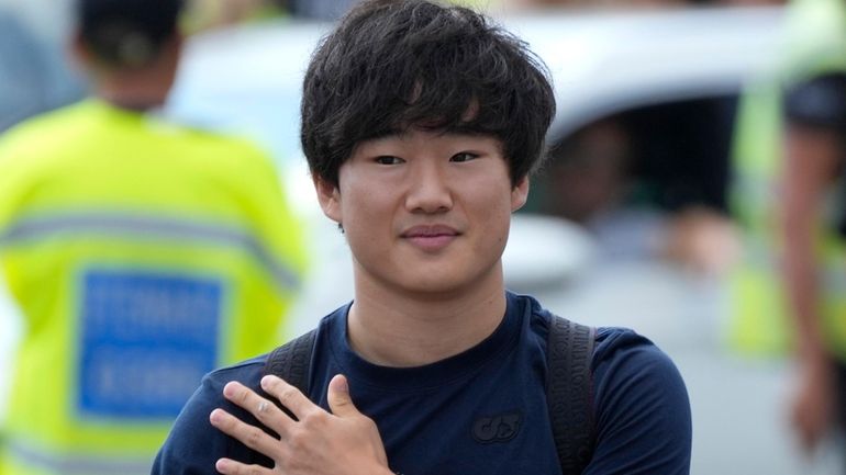 AlphaTauri driver Yuki Tsunoda of Japan arrives at the Monza...