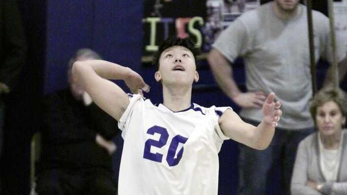 Port Washington's Jongho Byun serves against Plainview JFK. (Oct. 17,...