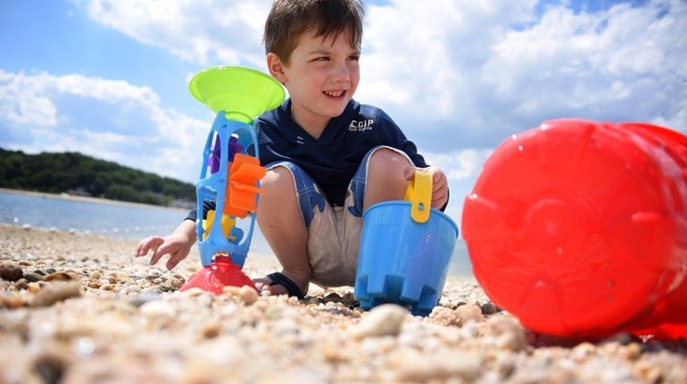 Xavier Schaeffer, 4, of Greenlawn, plays in the sunshine at...