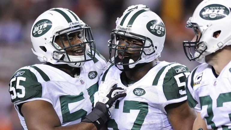 New York Jets inside linebacker Bart Scott (57) is congratulated...