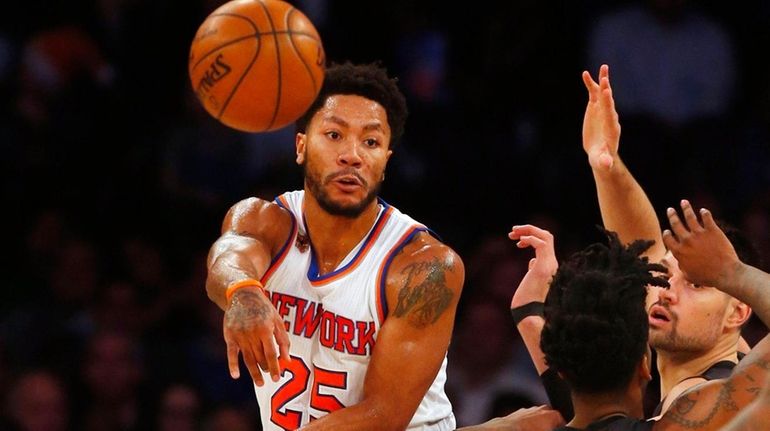 Derrick Rose #25 of the New York Knicks passes the...