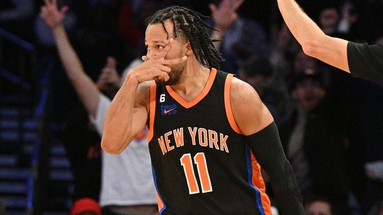 Knicks guard Jalen Brunson reacts after sinking a three-point basket...