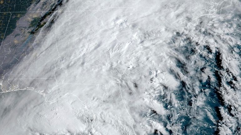 This satellite image provided by NOAA shows Hurricane Helene advancing...