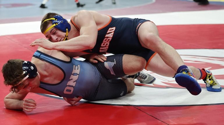 Matthew Rodriguez of East Meadow wrestles Sam Szerlip of Nyack in...