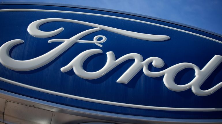 A Ford company logo on a sign at a Ford...