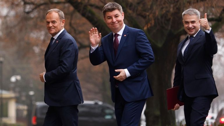 Polish Prime Minister Donald Tusk, left, Jan Grabiec, chief of...