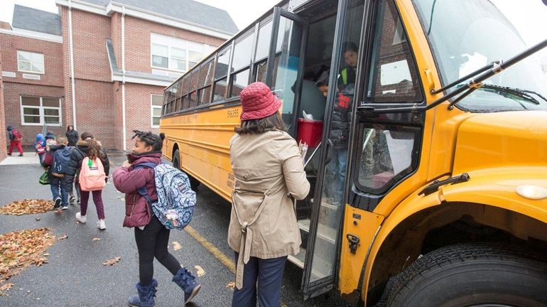 Students are dropped off at Archer Street Elementary School in...