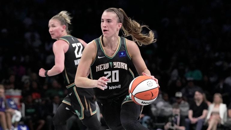 Sabrina Ionescu of the Liberty dribbles against the Phoenix Mercury at...