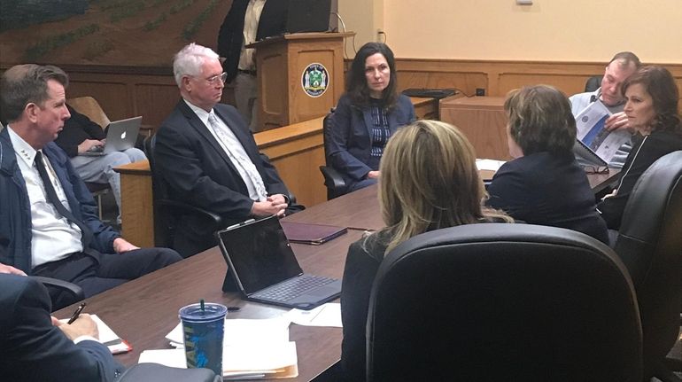 From left, Riverhead Police Chief David Hegermiller and Riverhead Town justices...