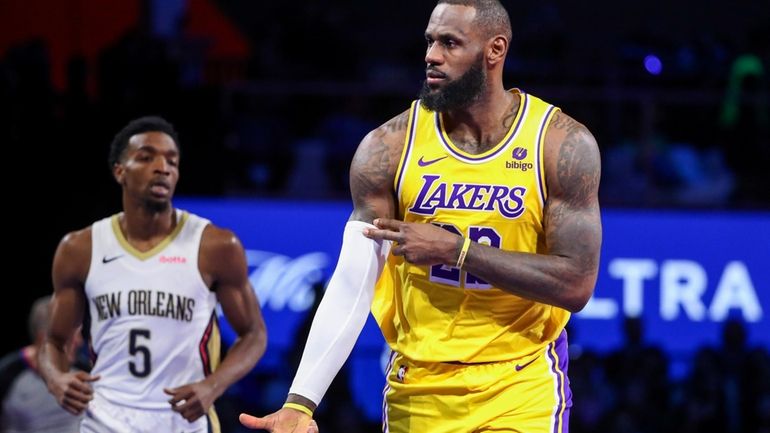 Los Angeles Lakers forward LeBron James (23) celebrates after making...