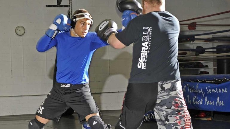 Al Iaquinta of Wantagh spars with James Gabert at Ray...