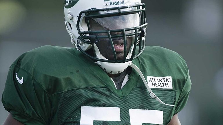 Ricky Sapp stands on the field during training camp at...