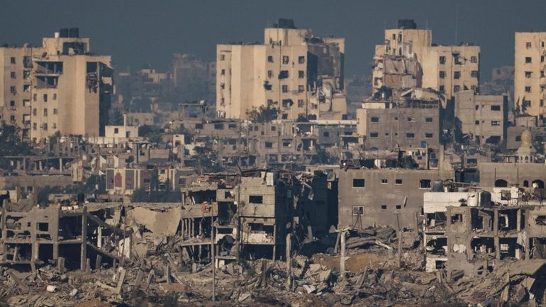 Destroyed buildings stand in the Gaza Strip, as seen from...