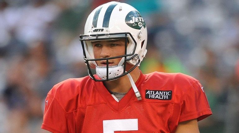 Christian Hackenberg heads to the sideline during the Jets' annual...