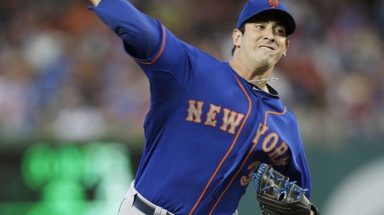 Mets starting pitcher Matt Harvey throws to a Washington Nationals...