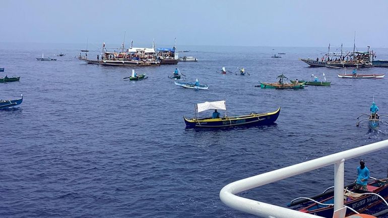 In this photo provided by the Philippine Coast Guard, fishing...