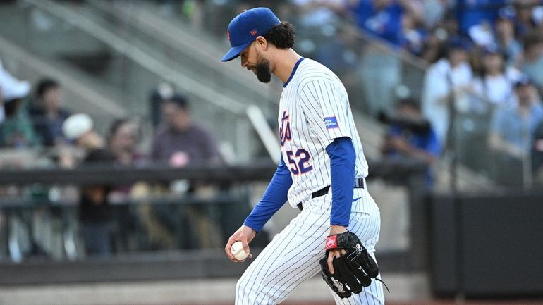 Mets pitcher Jorge López reacts during the eighth inning against...