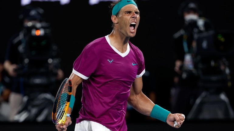 Rafael Nadal of Spain reacts after winning the third set...