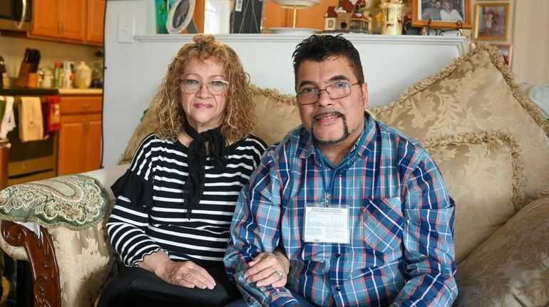 Jesus Marte Jr., and his wife Maria, inside their Moriches...