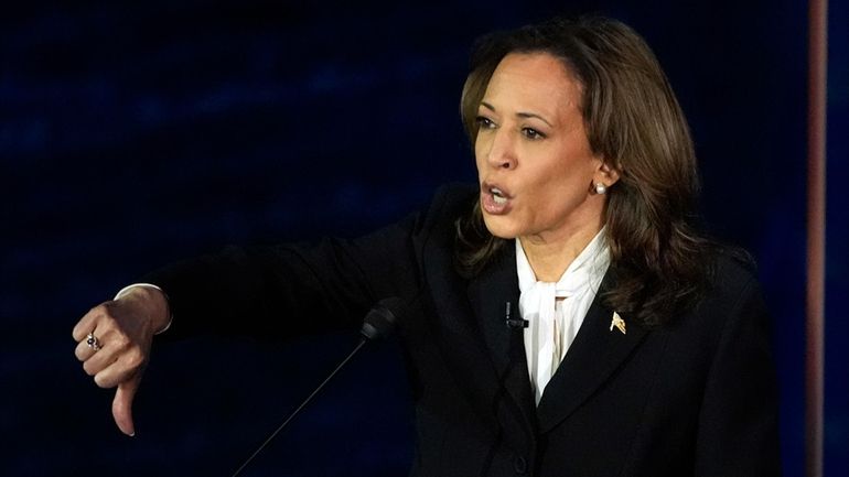 Democratic presidential nominee Vice President Kamala Harris gestures as she...