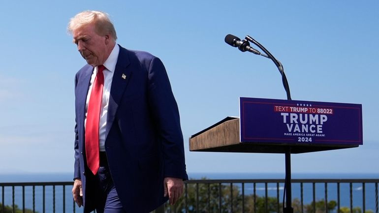 Republican presidential nominee former President Donald Trump leaves the podium...