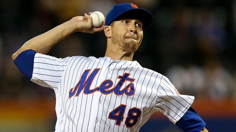 Jacob deGrom of the Mets pitches during the first inning against...