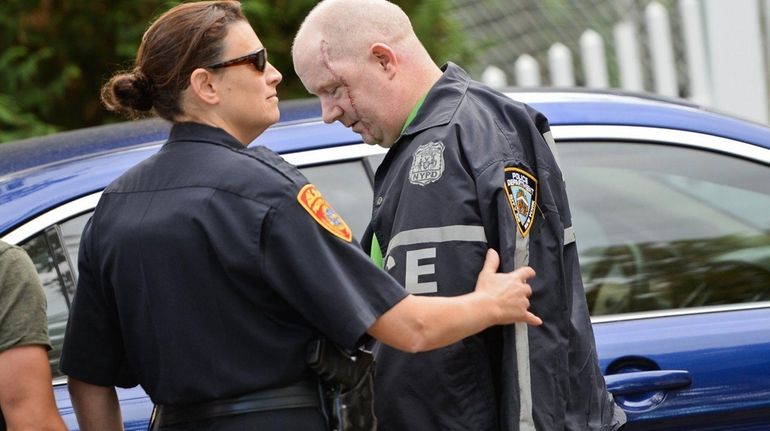 NYPD Detective Brian O'Donnell is greeted by a Suffolk County...