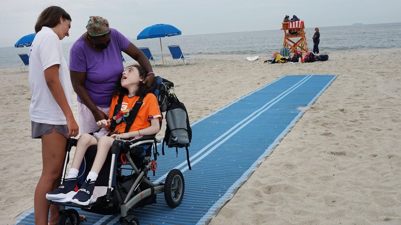 Mats let beachgoers in wheelchairs get closer to the ocean in Hempstead