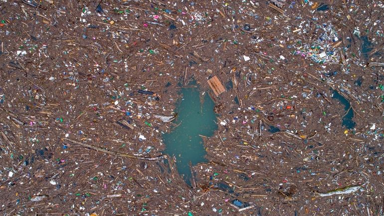 Aerial view of waste floating in the Drina river near...