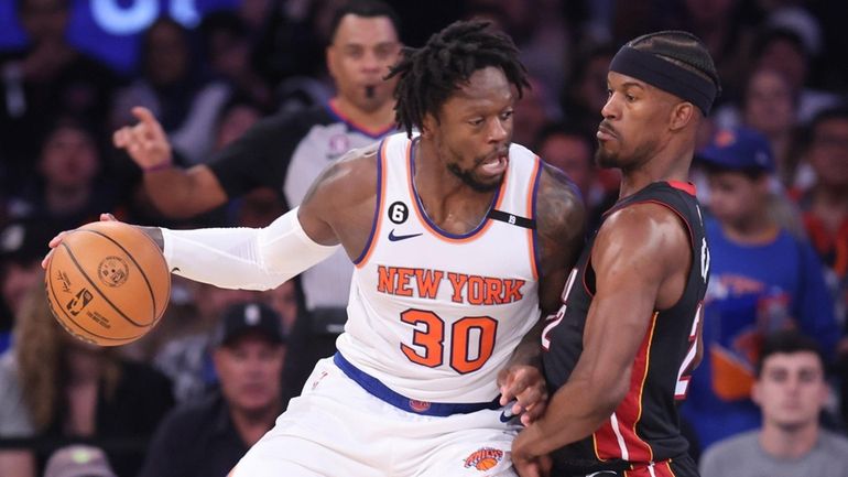 Knicks forward Julius Randle dribbles against Miami Heat forward Jimmy...